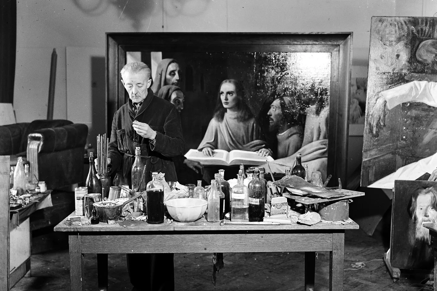 Han van Meegeren painting in custody, 1945, proving he was a forger and not a Nazi collaborator